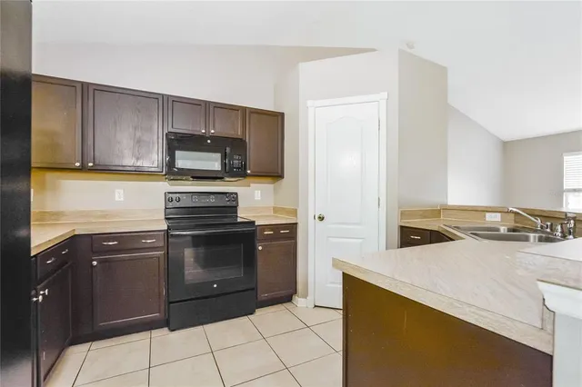 a kitchen with a stove and a sink