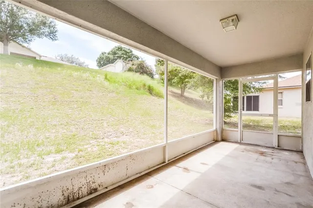a view of an empty room and window