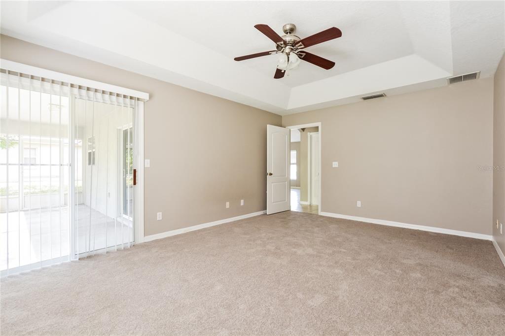 713 Willow Run Street Minneola, FL 34715 - Photo 9 of 16 a view of an empty room with a window