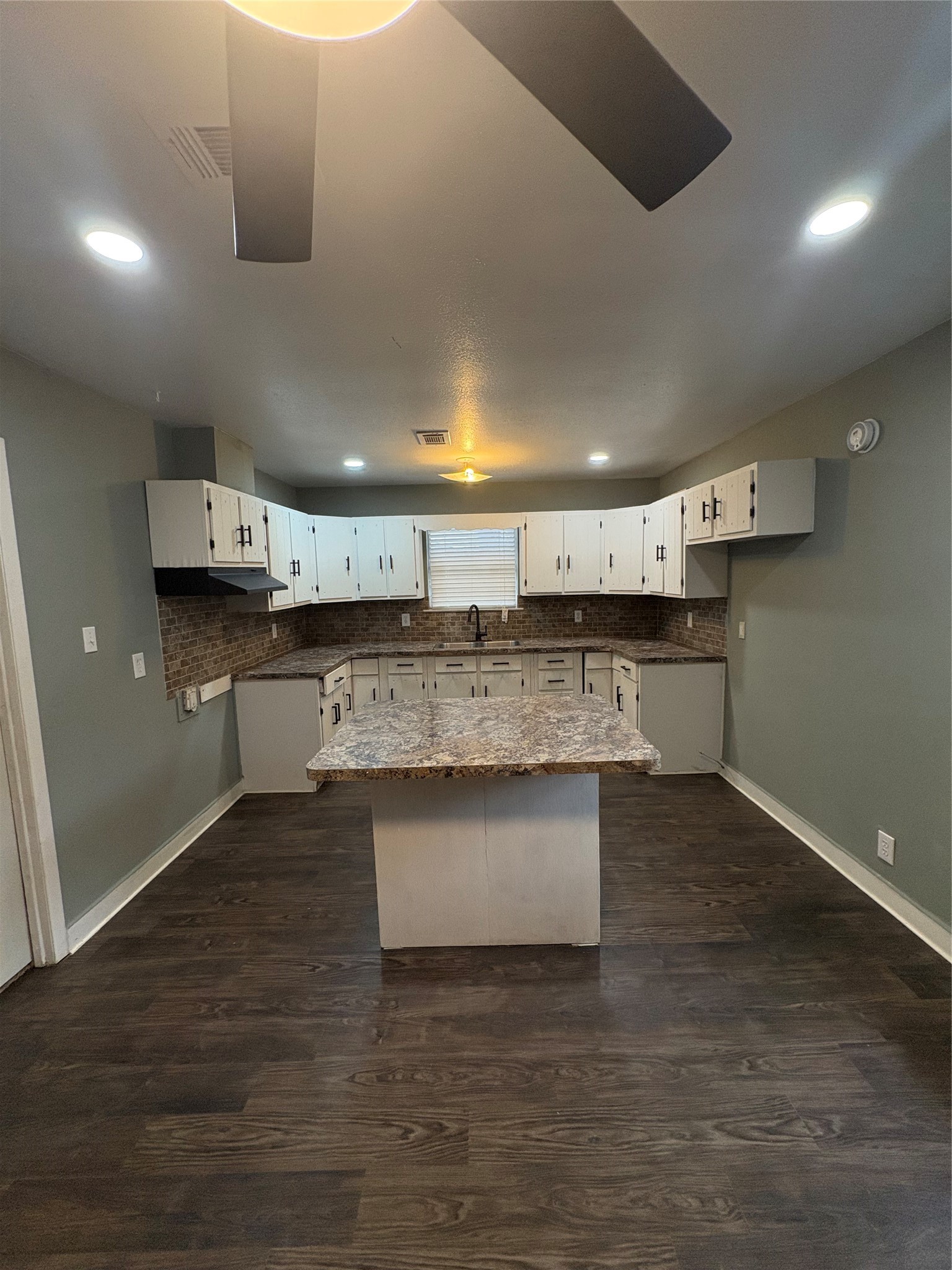 1301 Magnolia Point Drive Huffman, TX 77336 - Photo 5 of 12 a kitchen with stainless steel appliances granite countertop a sink and a stove
