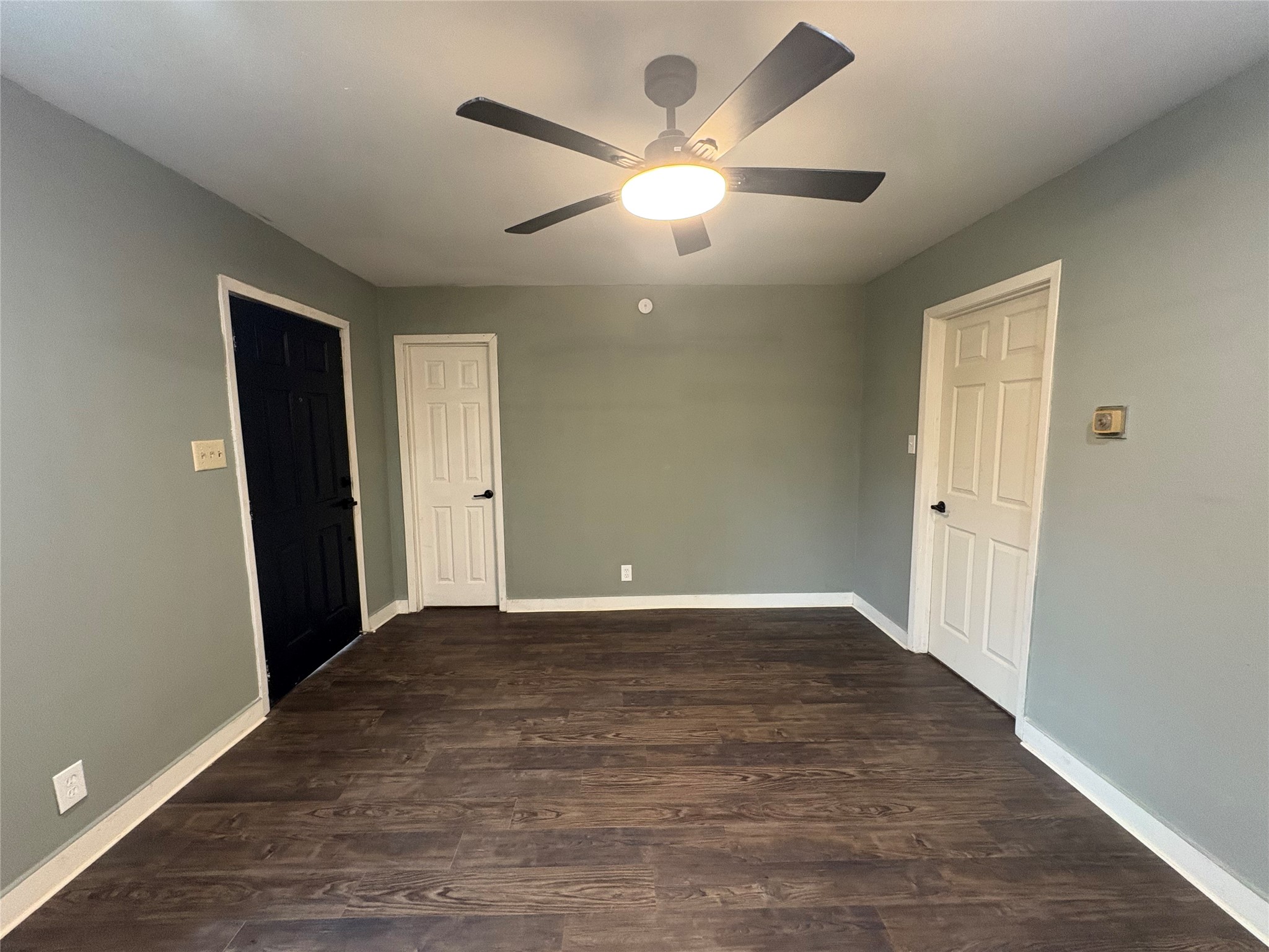 1301 Magnolia Point Drive Huffman, TX 77336 - Photo 6 of 12 an empty room with wooden floor and windows