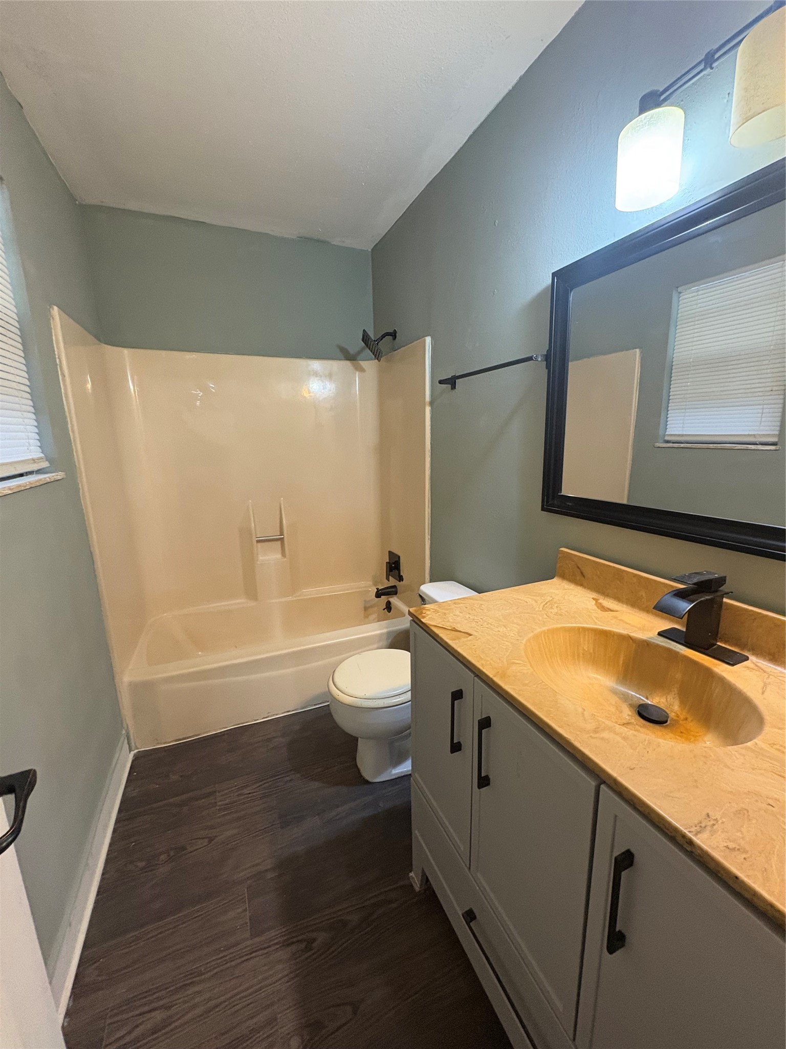 1301 Magnolia Point Drive Huffman, TX 77336 - Photo 9 of 12 a bathroom with a granite countertop sink toilet and shower