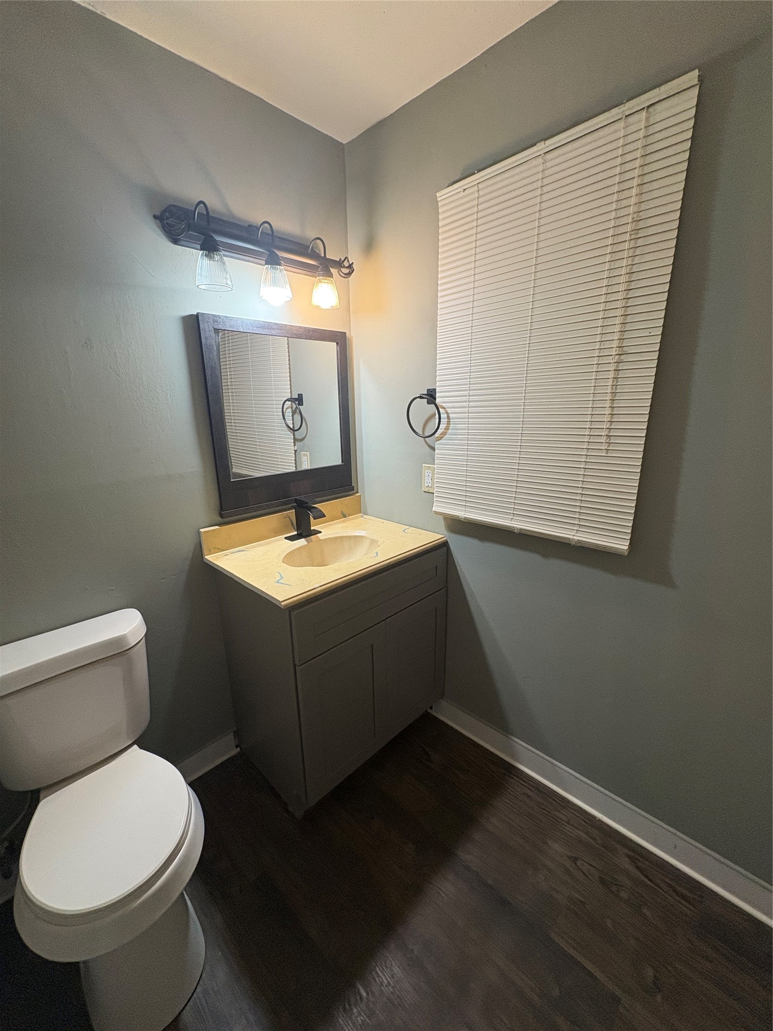 1301 Magnolia Point Drive Huffman, TX 77336 - Photo 10 of 12 a bathroom with a toilet sink and mirror