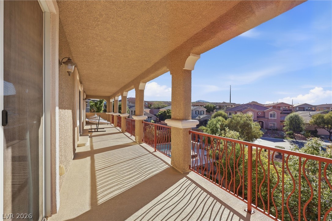 2737 Tarbert Street Henderson, NV 89044 - Photo 12 of 60 An inviting balcony offers ample space for relaxation and enjoying scenic neighborhood views.