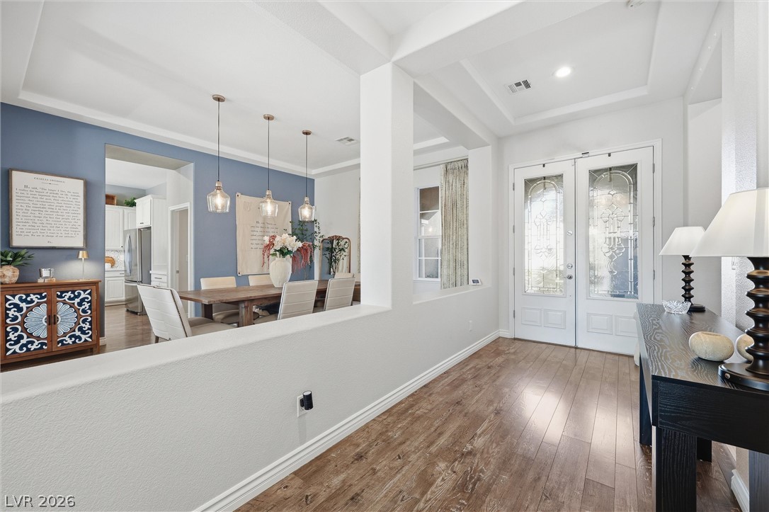 2737 Tarbert Street Henderson, NV 89044 - Photo 59 of 60 This inviting home features an open floorplan with durable hardwood flooring and a stylish tray ceiling.