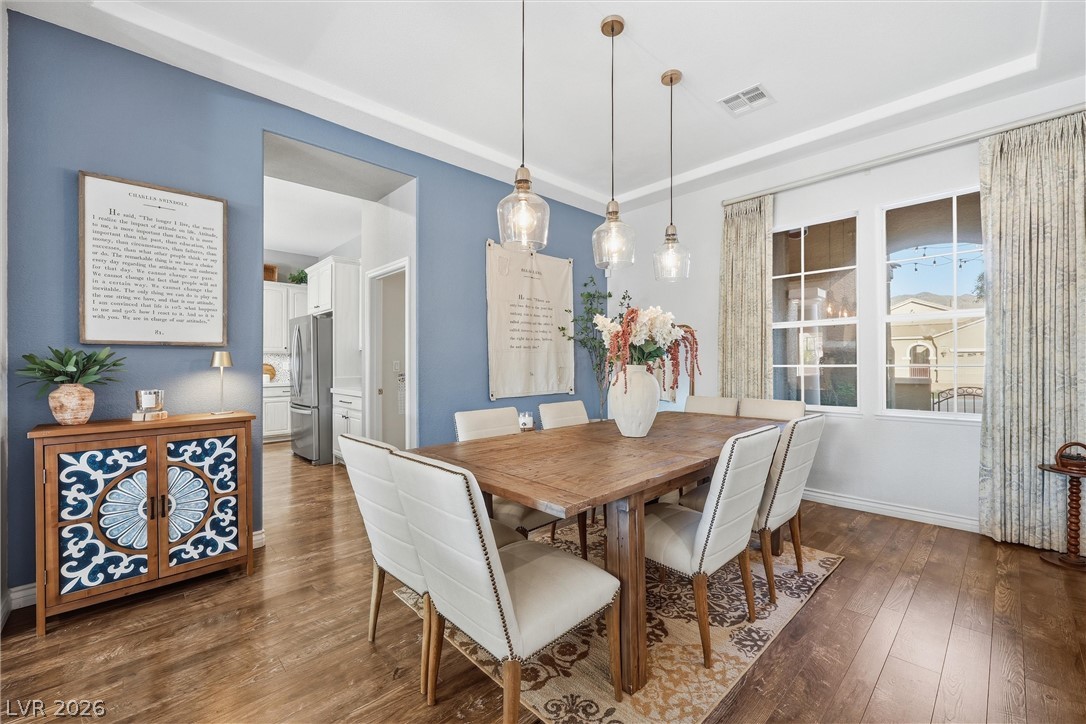 2737 Tarbert Street Henderson, NV 89044 - Photo 13 of 60 This bright dining area offers elegant lighting and ample space for gatherings.