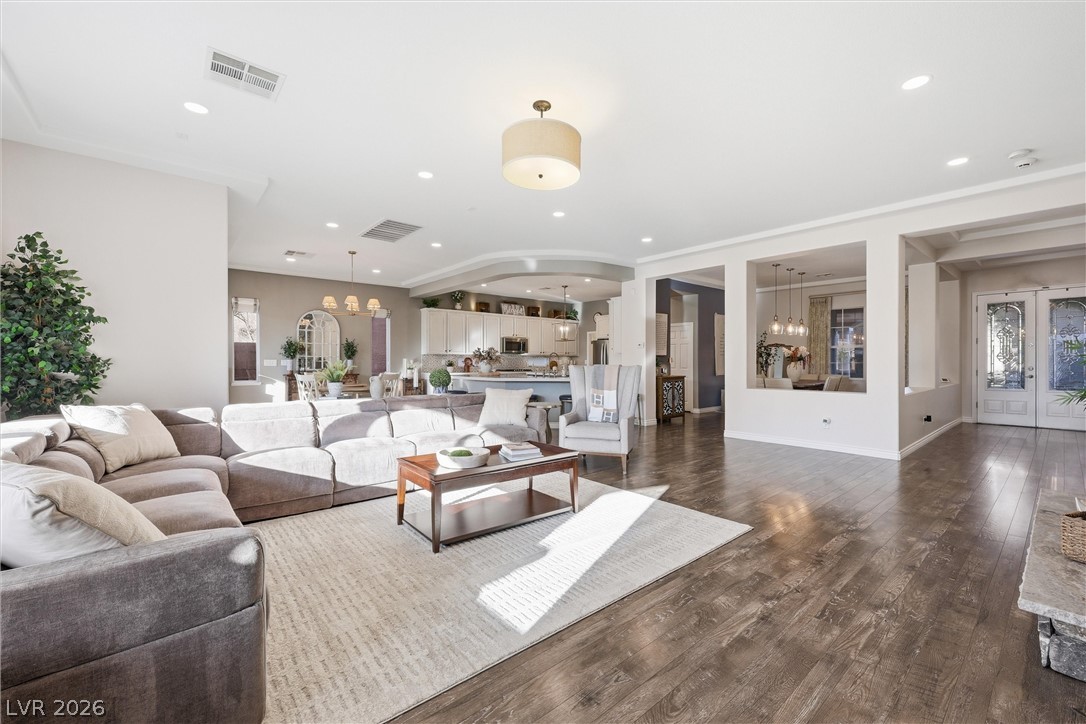2737 Tarbert Street Henderson, NV 89044 - Photo 15 of 60 This airy open-concept living area boasts abundant natural light and seamless flow between spaces.