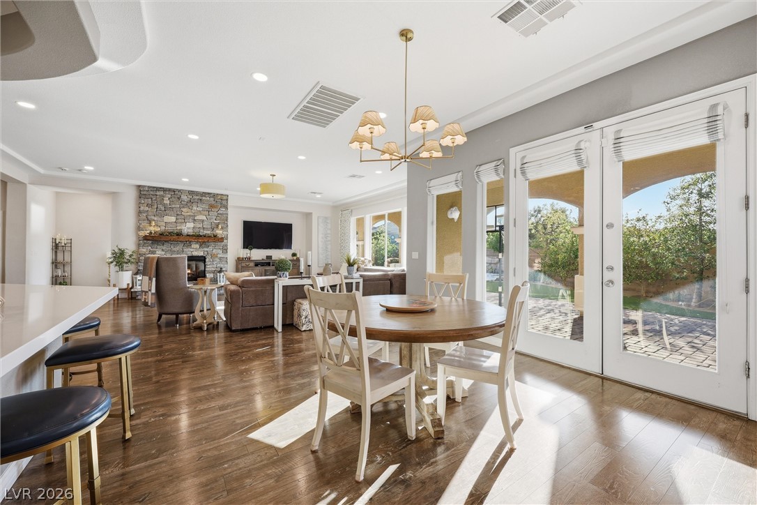 2737 Tarbert Street Henderson, NV 89044 - Photo 18 of 60 This luminous open-concept living space features warm hardwood floors and abundant natural light.