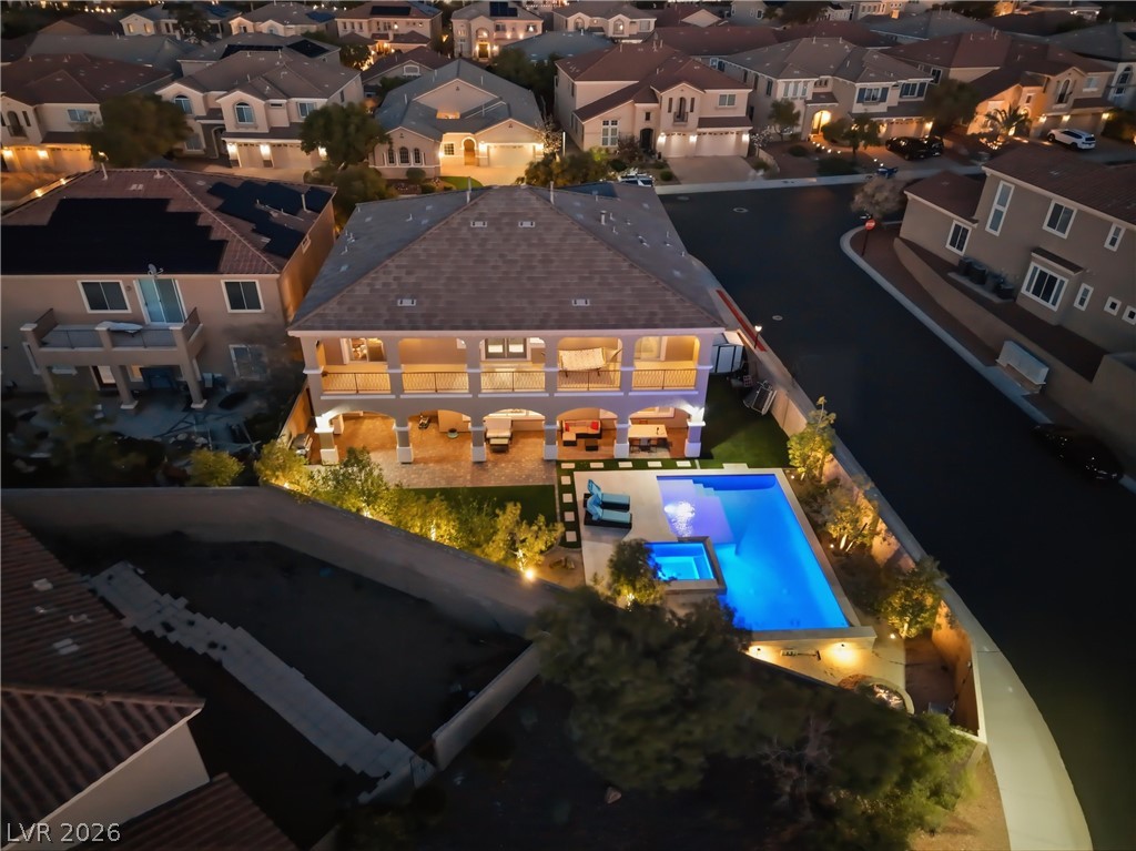 2737 Tarbert Street Henderson, NV 89044 - Photo 2 of 60 This elevated view captures a home's inviting outdoor living space with a sparkling pool.