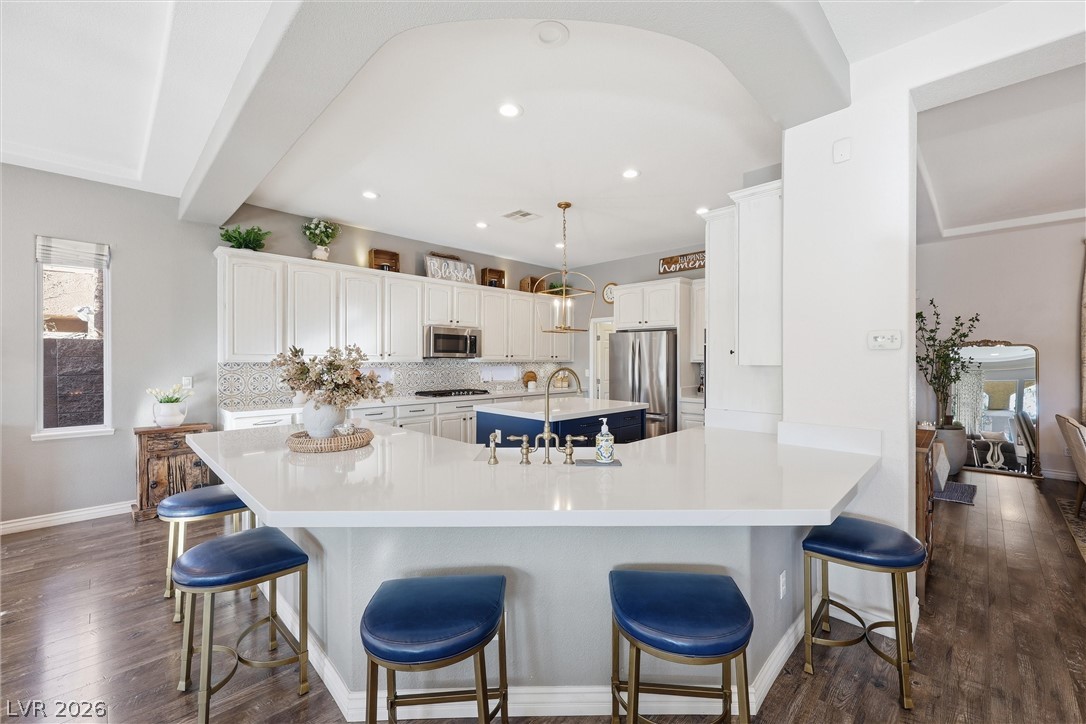 2737 Tarbert Street Henderson, NV 89044 - Photo 22 of 60 This kitchen features a spacious island and bright cabinetry, perfect for entertaining.