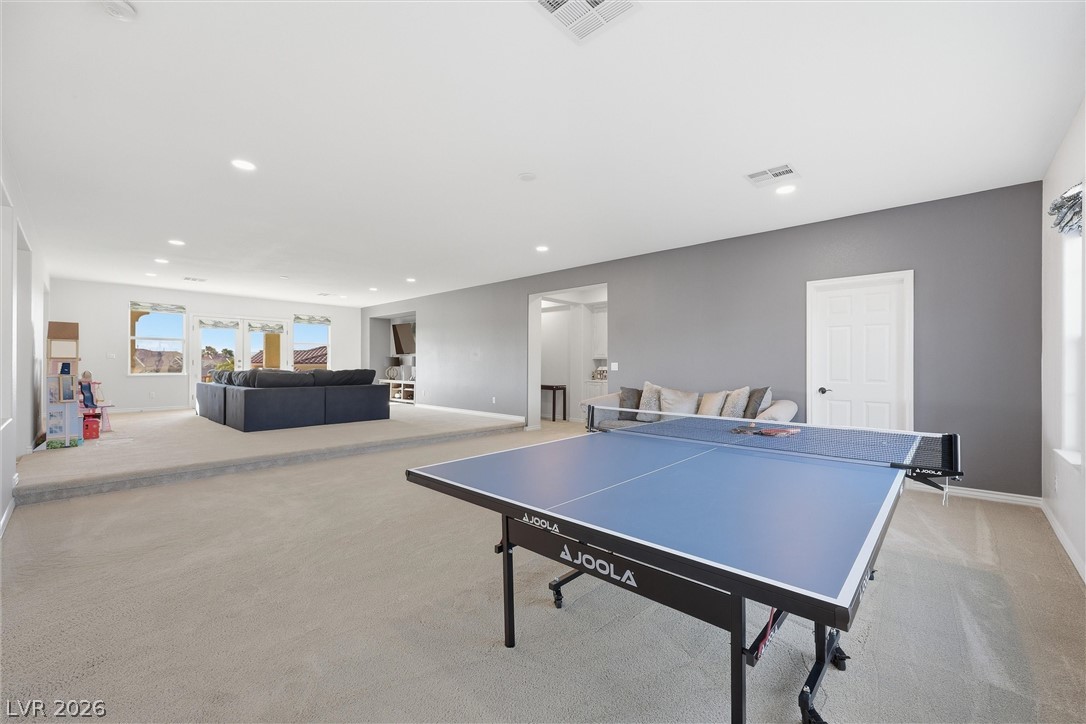 2737 Tarbert Street Henderson, NV 89044 - Photo 24 of 60 This versatile recreation space offers ample room for games and relaxation, ideal for entertaining guests.