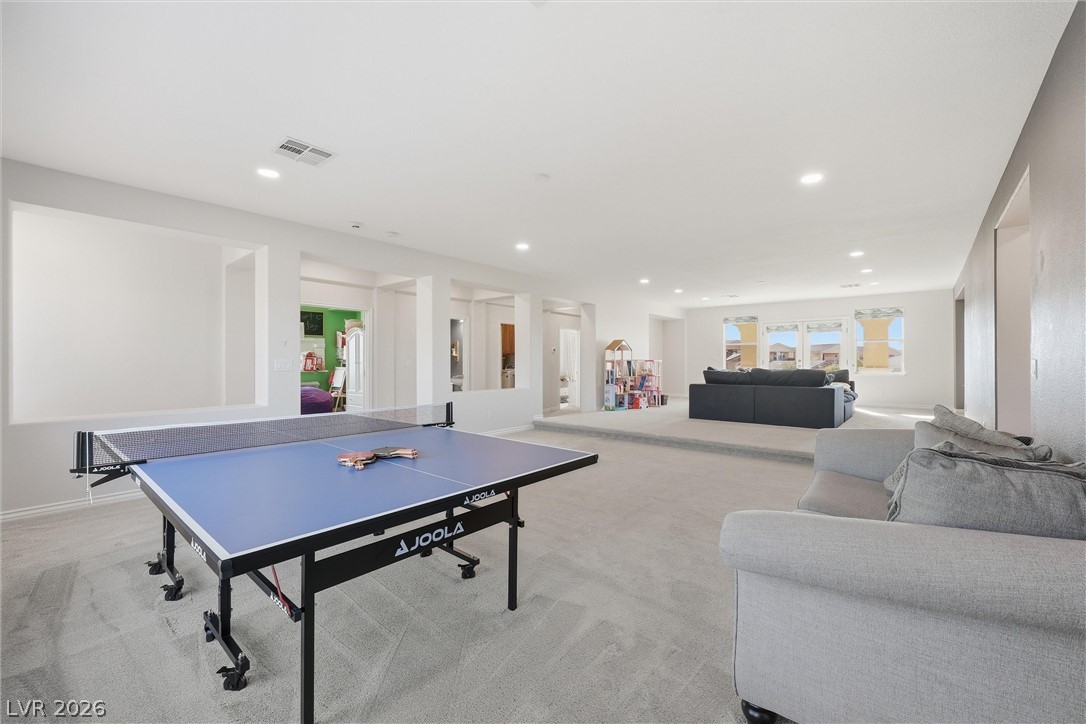 2737 Tarbert Street Henderson, NV 89044 - Photo 25 of 60 This spacious bonus room features an elevated area, perfect for various activities.