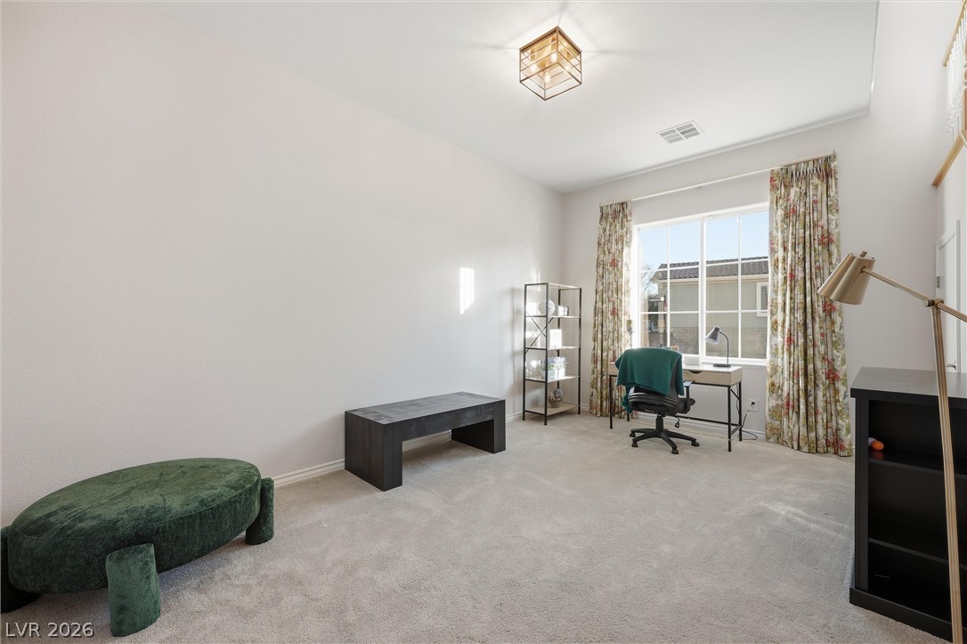 2737 Tarbert Street Henderson, NV 89044 - Photo 28 of 60 Bright and airy living area featuring plush carpeting and a large window.