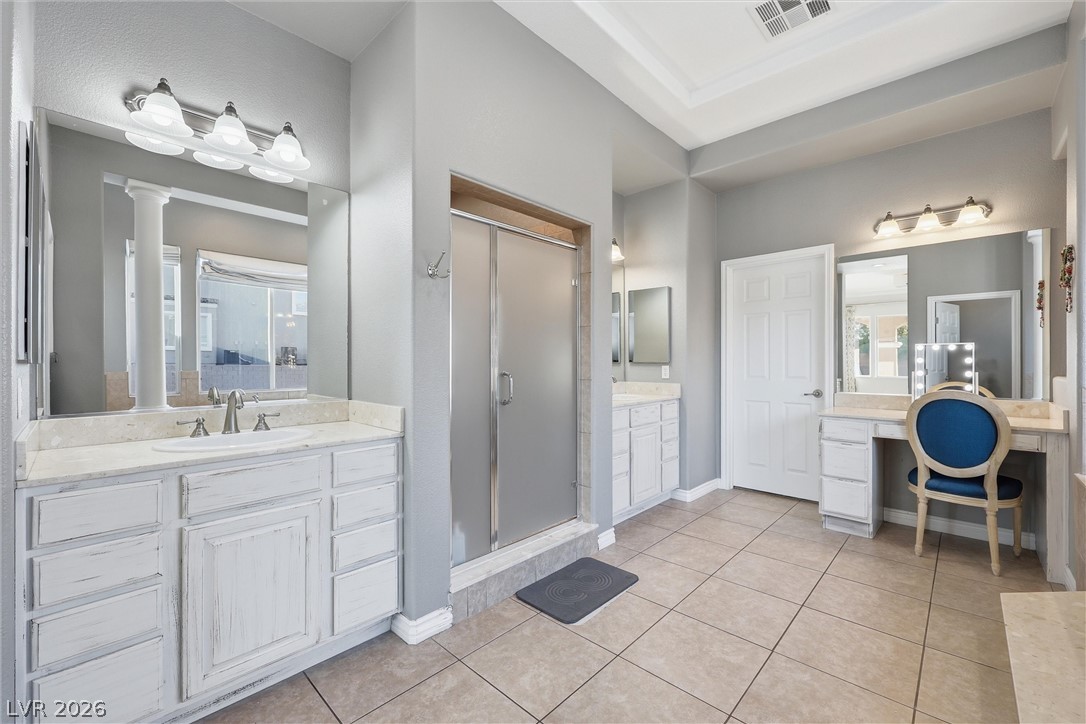 2737 Tarbert Street Henderson, NV 89044 - Photo 33 of 60 This spacious bathroom offers a relaxing ambiance with ample counter space and a convenient shower.
