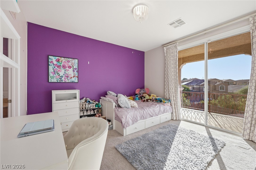 2737 Tarbert Street Henderson, NV 89044 - Photo 38 of 60 This spacious bedroom offers comfortable living with direct access to an outdoor balcony.