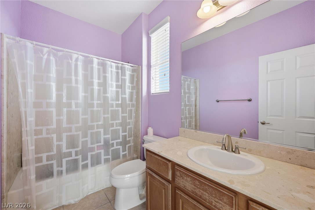 2737 Tarbert Street Henderson, NV 89044 - Photo 39 of 60 This bathroom features a sleek vanity and a combination shower and tub.