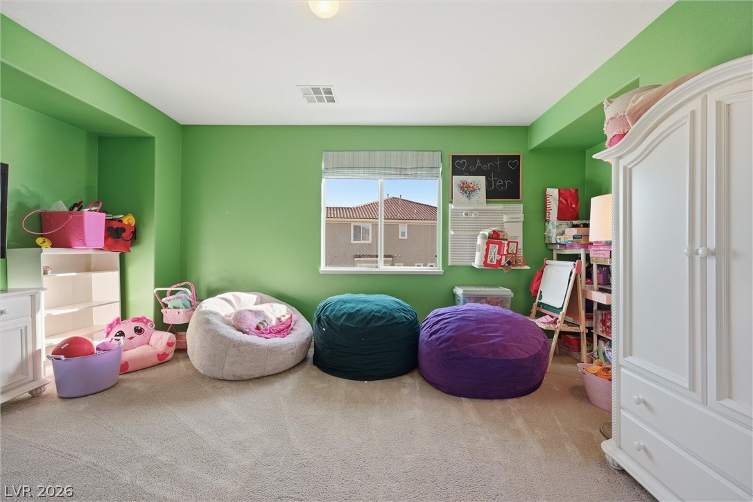 2737 Tarbert Street Henderson, NV 89044 - Photo 40 of 60 This cozy room offers a bright and playful atmosphere, ideal for various activities and relaxation.