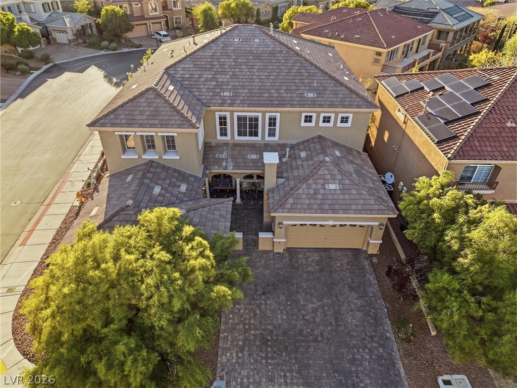 2737 Tarbert Street Henderson, NV 89044 - Photo 44 of 60 This spacious residence boasts a beautifully tiled roof and an inviting driveway, offering comfort and convenience.