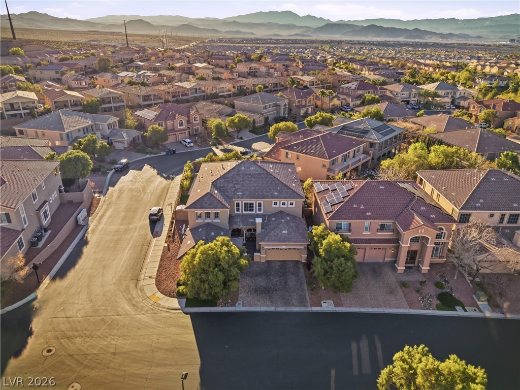2737 Tarbert Street Henderson, NV 89044 - Photo 45 of 60 An aerial perspective reveals a vibrant neighborhood nestled among scenic desert mountains.