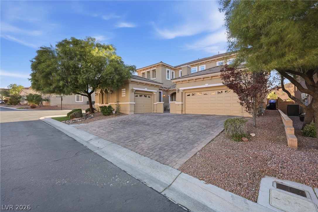 2737 Tarbert Street Henderson, NV 89044 - Photo 46 of 60 This residence features a paver driveway, offering a distinct and welcoming approach.