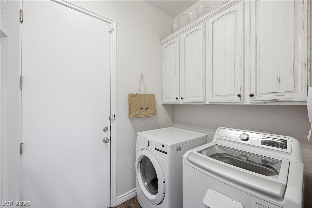 2737 Tarbert Street Henderson, NV 89044 - Photo 53 of 60 This functional laundry room features convenient appliances and ample storage for organization.