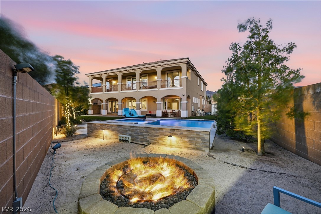 2737 Tarbert Street Henderson, NV 89044 - Photo 6 of 60 This spacious home boasts a luxurious backyard oasis, perfect for entertaining under vibrant sunsets.