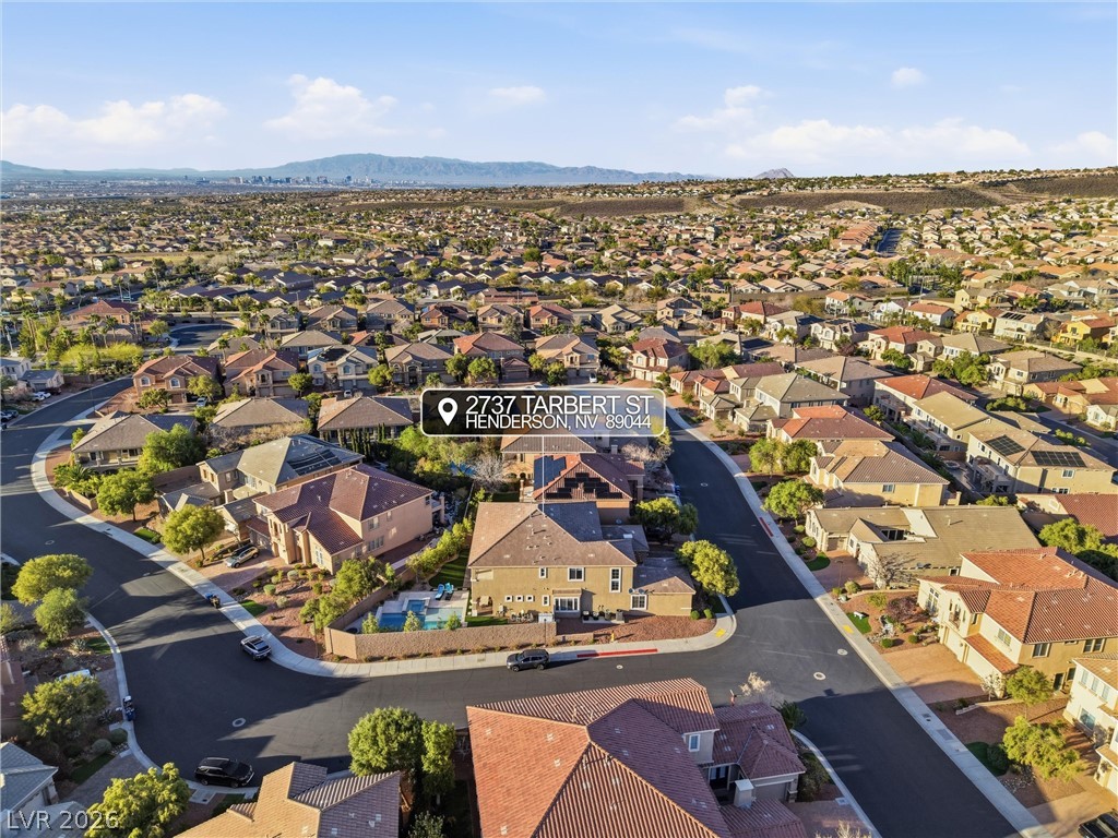 2737 Tarbert Street Henderson, NV 89044 - Photo 10 of 60 An aerial view captures the expansive neighborhood with distant mountain and city views.