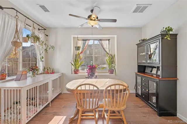 a living room with furniture a window and a chandelier