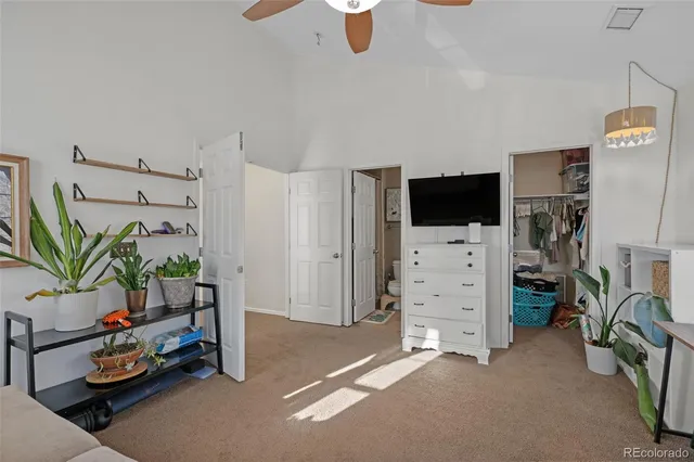 a view of a livingroom with furniture and a flat screen tv