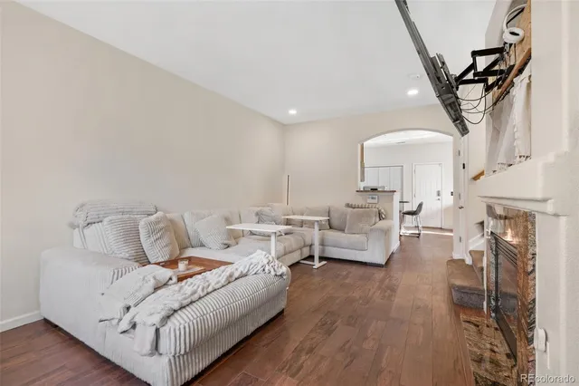 a living room with fireplace furniture and a chandelier