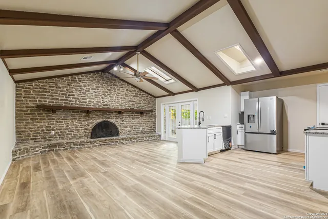 a view of kitchen with a sink and wooden floor