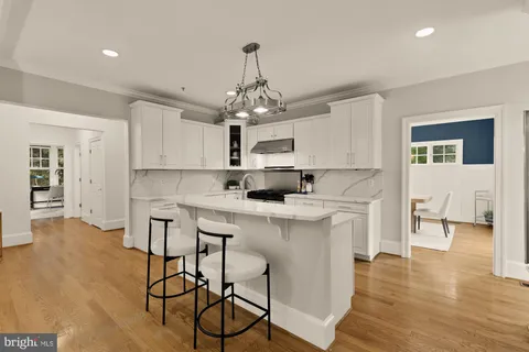 a kitchen with cabinets appliances and a counter
