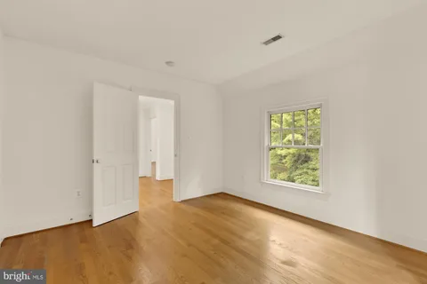 a view of a hallway with stairs