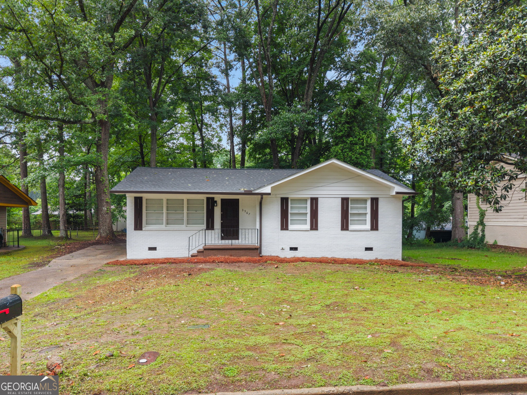 3567 Forrest Park Road Southeast Atlanta, GA 30354 - Photo 2 of 29 a front view of a house with garden