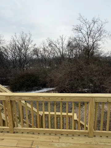 a view of building with large window and trees