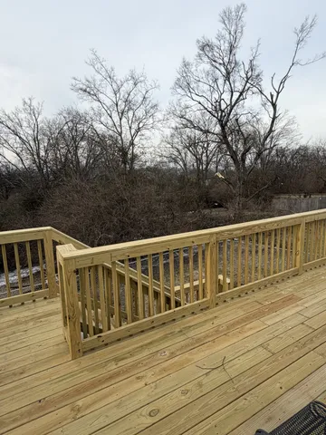 a balcony with wooden floor