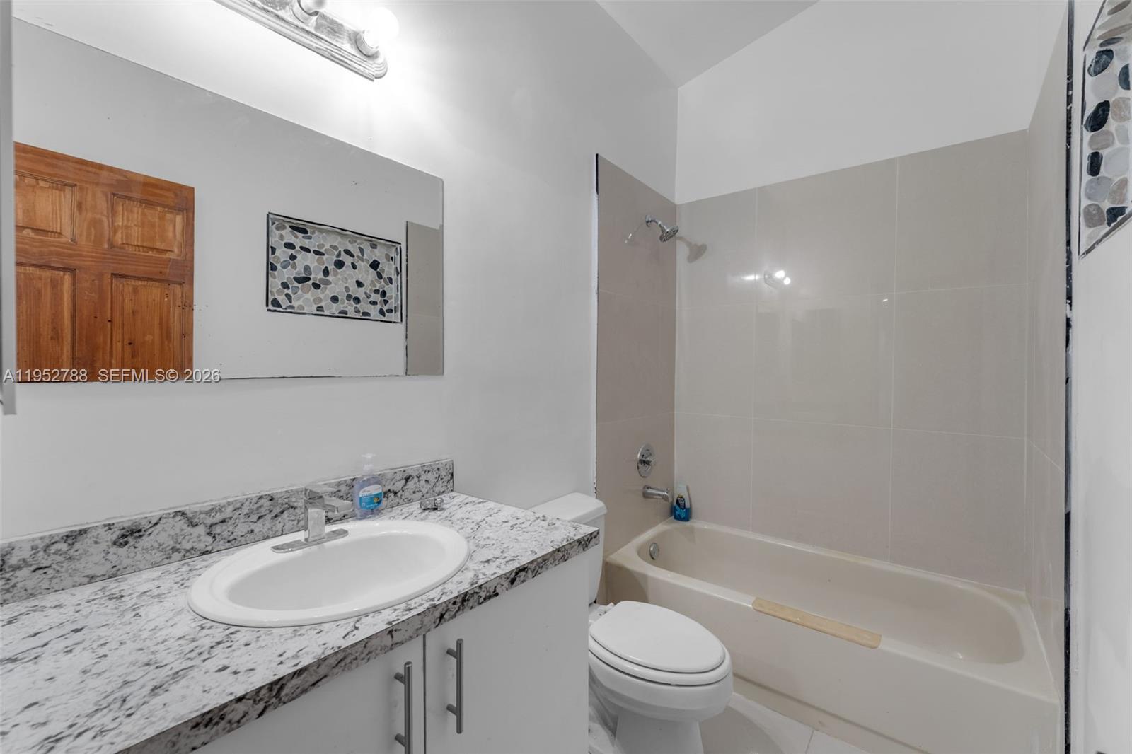 13202 Southwest 276th Terrace Homestead, FL 33032 - Photo 11 of 19 a bathroom with a granite countertop sink toilet and shower