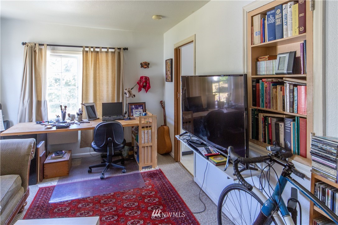717 Franklin Street Port Townsend, WA 98368 - Photo 15 of 25 a view of a workspace with furniture and a bookshelf