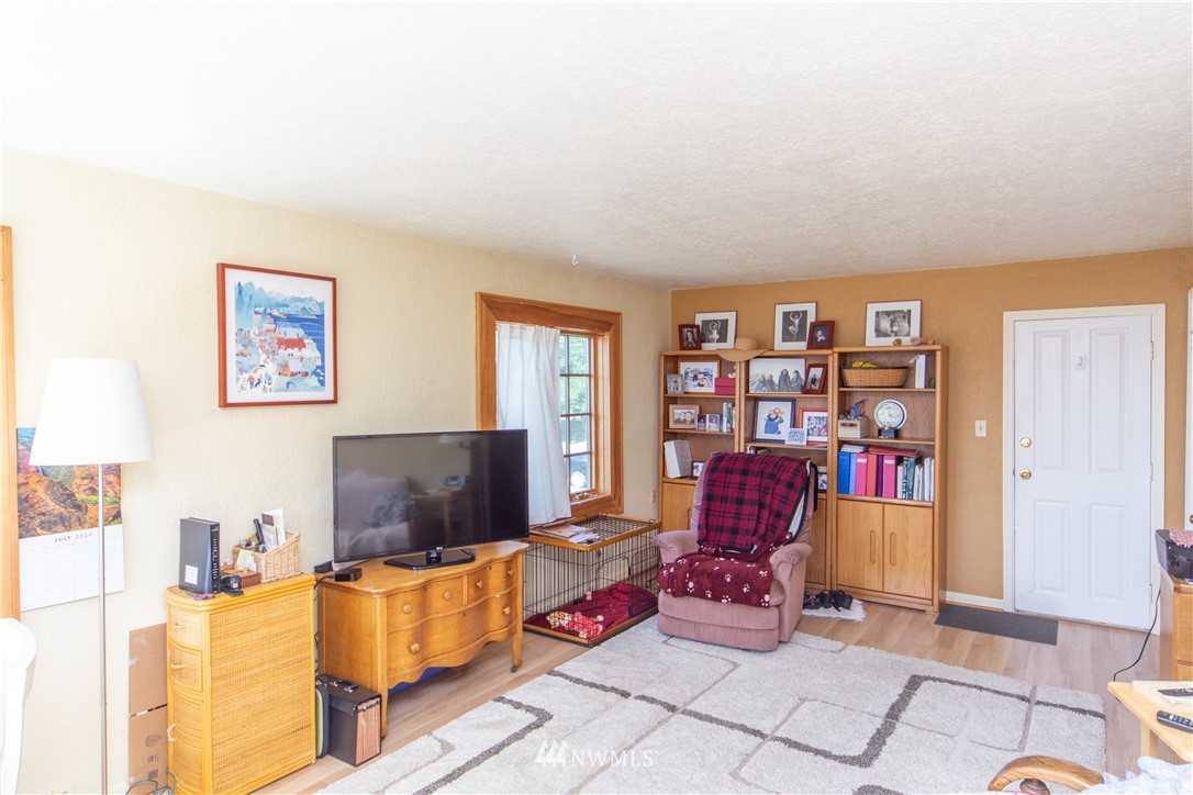 717 Franklin Street Port Townsend, WA 98368 - Photo 16 of 25 a living room with furniture and a flat screen tv