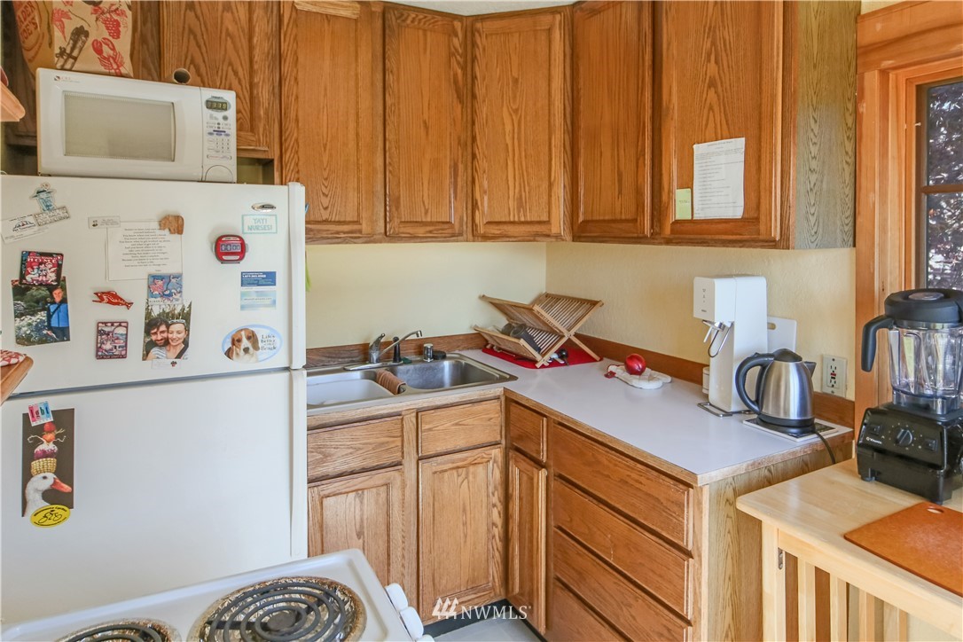 717 Franklin Street Port Townsend, WA 98368 - Photo 19 of 25 a kitchen with a sink cabinets and appliances
