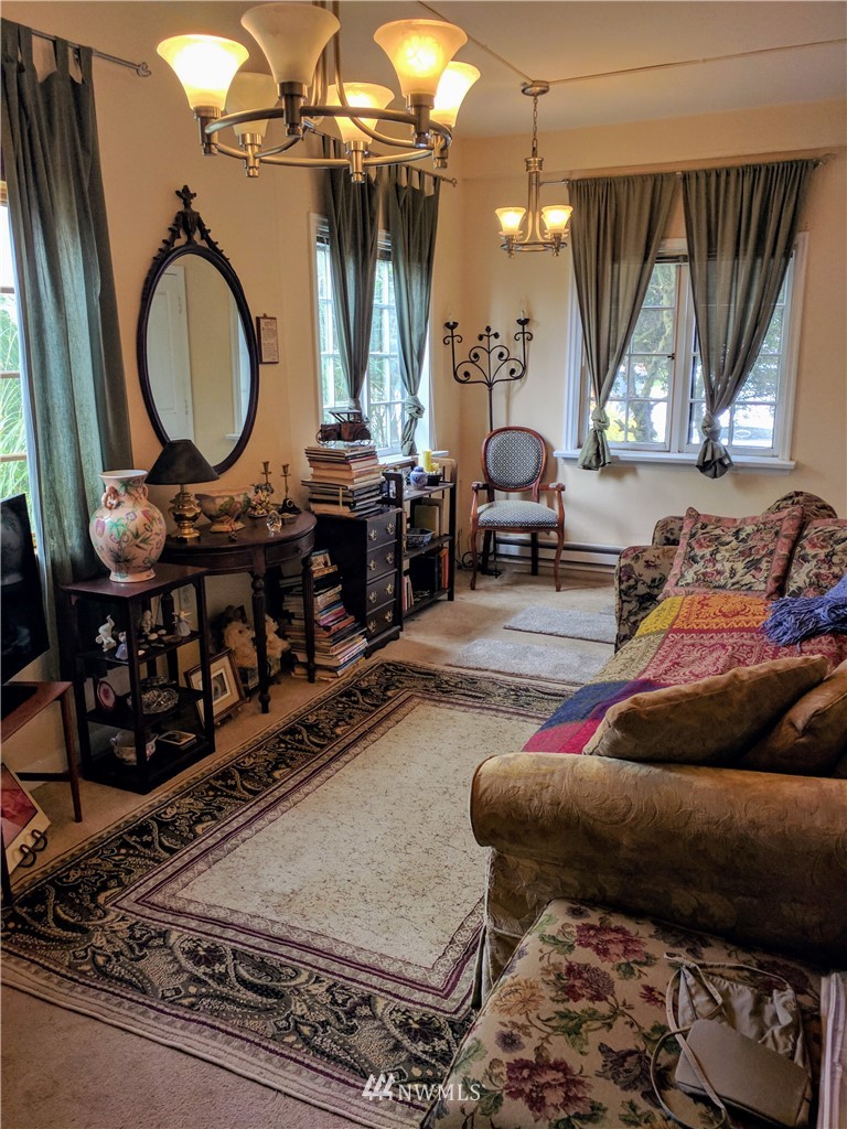 717 Franklin Street Port Townsend, WA 98368 - Photo 10 of 25 a living room filled with furniture and a chandelier