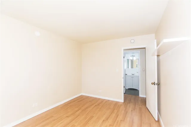 a view of a room with wooden floor