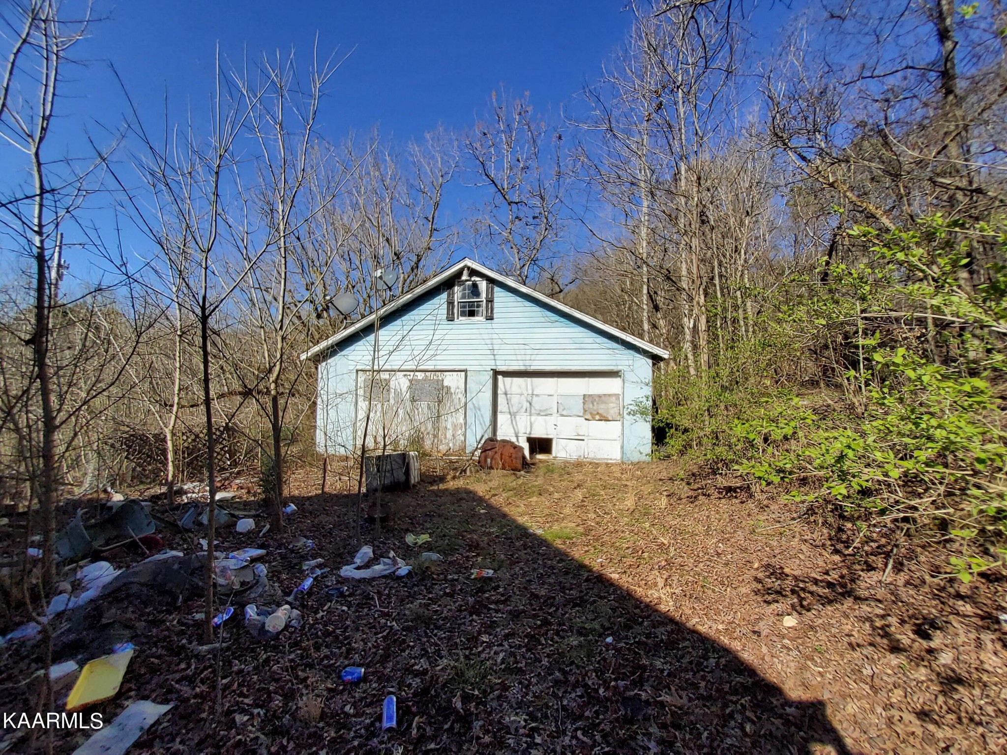 1858 Dumplin Loop Road New Market, TN 37820 - Photo 2 of 28 a view of a house with a small yard and large tree