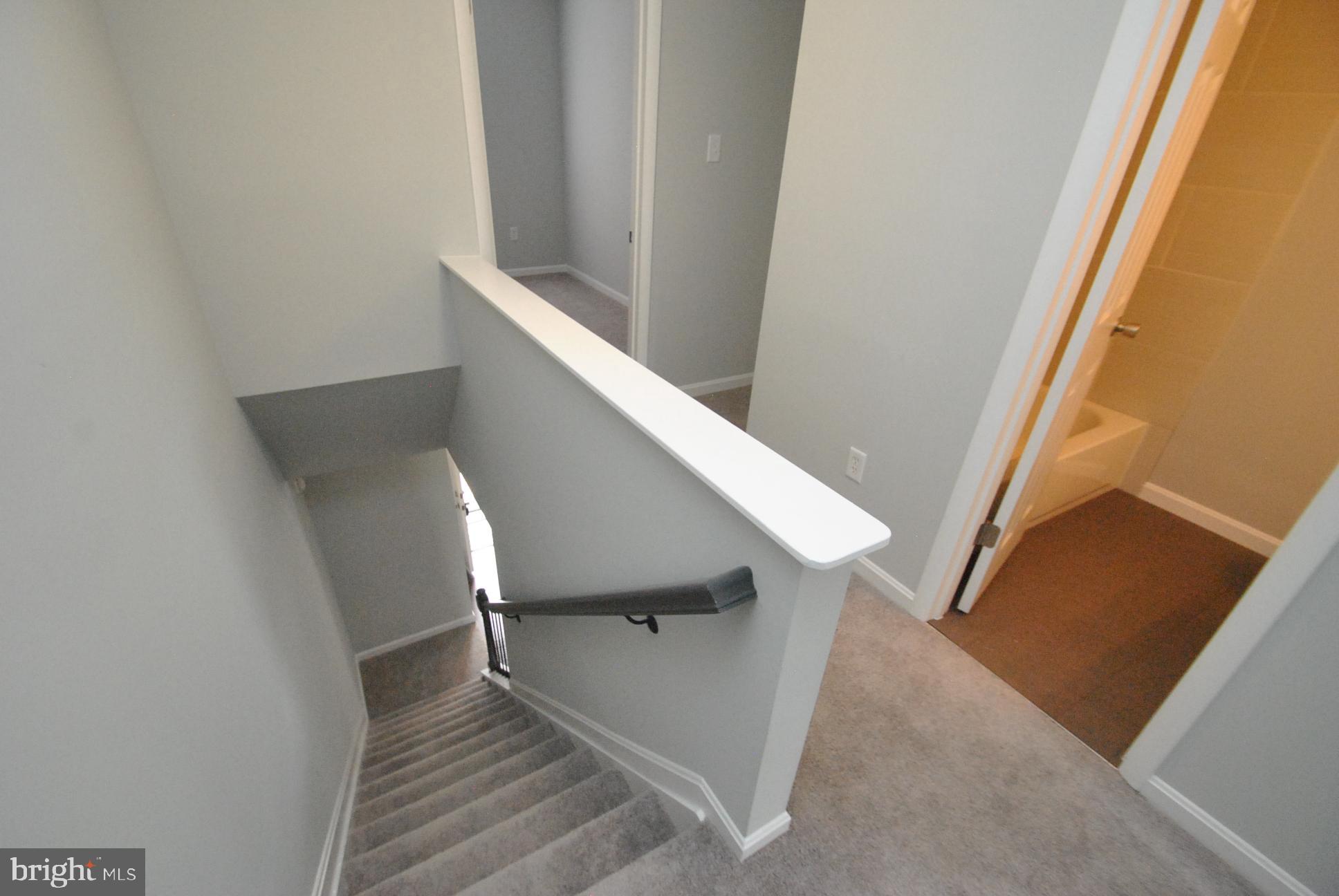 25 Open Gate Court Baltimore, MD 21236 - Photo 13 of 29 STAIRCASE VIEW FROM UPPER LEVEL