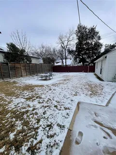a view of a backyard of the house