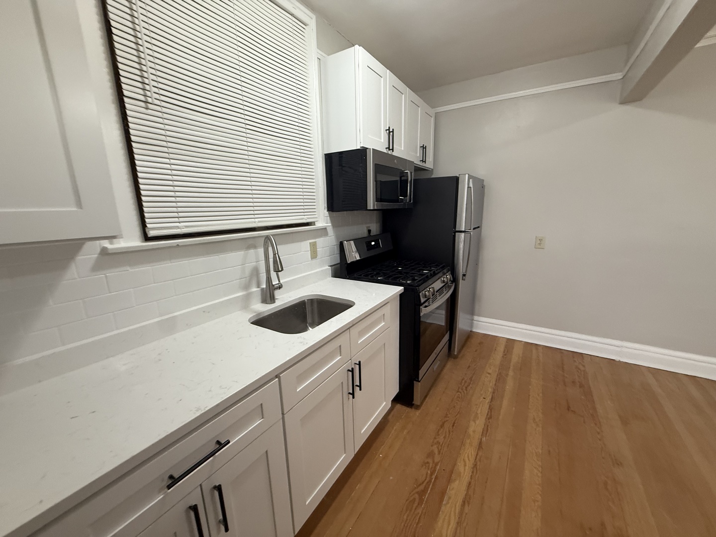 6829 21st Street, Unit 2E Berwyn, IL 60402 - Photo 11 of 15 a kitchen with a sink and cabinets
