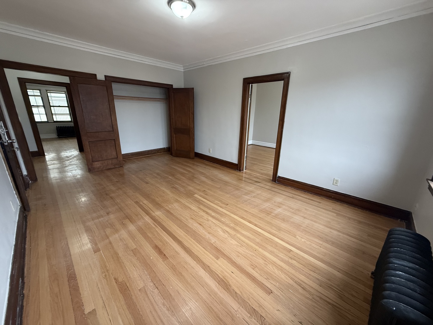 6829 21st Street, Unit 2E Berwyn, IL 60402 - Photo 4 of 15 a view of empty room with wooden floor and fan