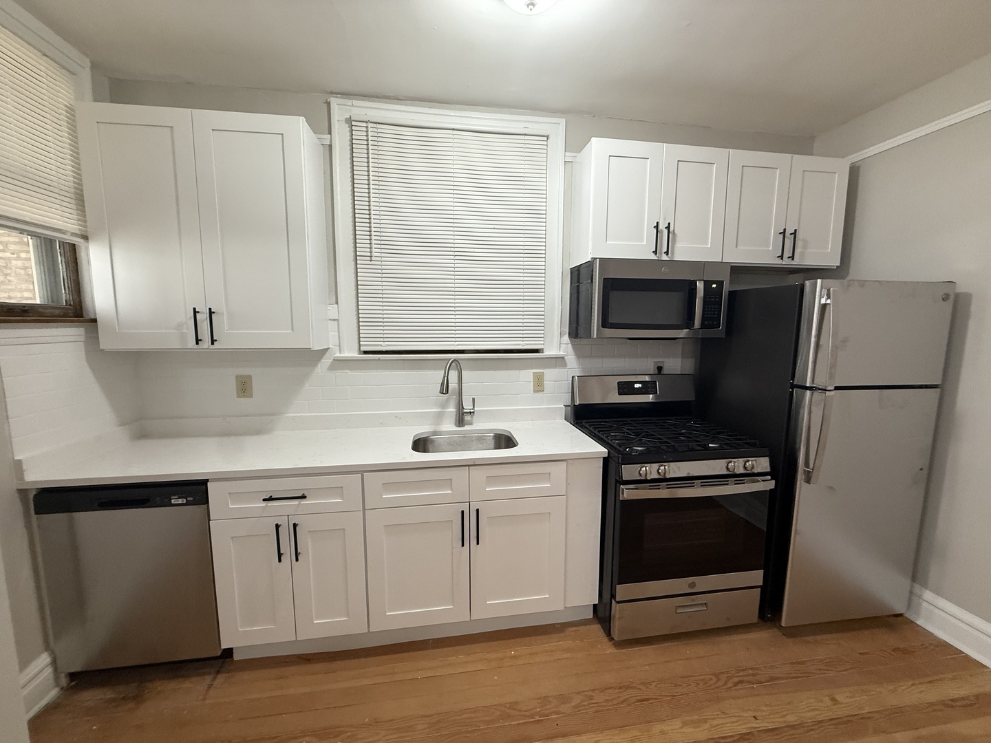 6829 21st Street, Unit 2E Berwyn, IL 60402 - Photo 10 of 15 a kitchen with a sink appliances and cabinets