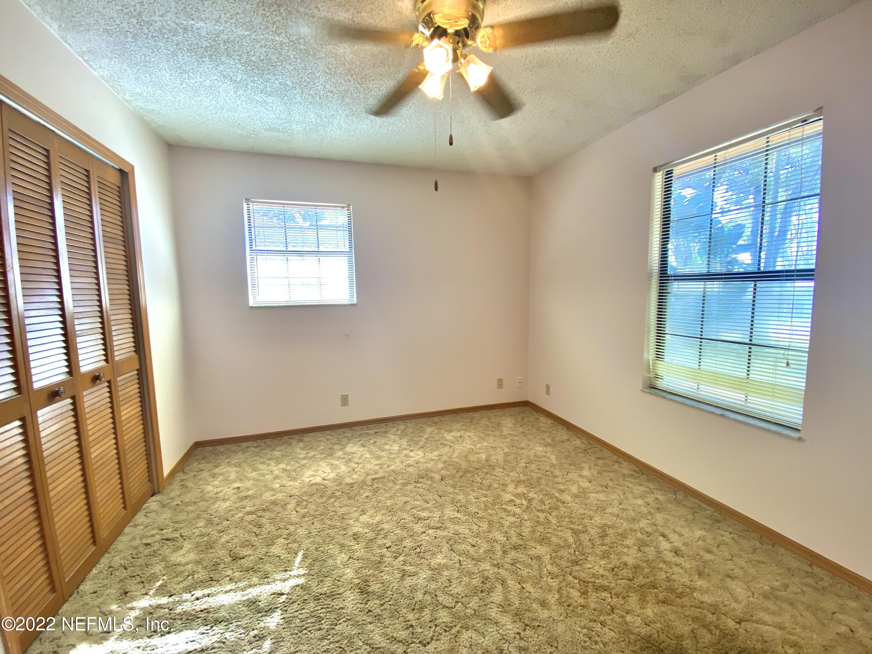 113 Aspen Road St. Augustine, FL 32086 - Photo 8 of 19 a view of an empty room with a window