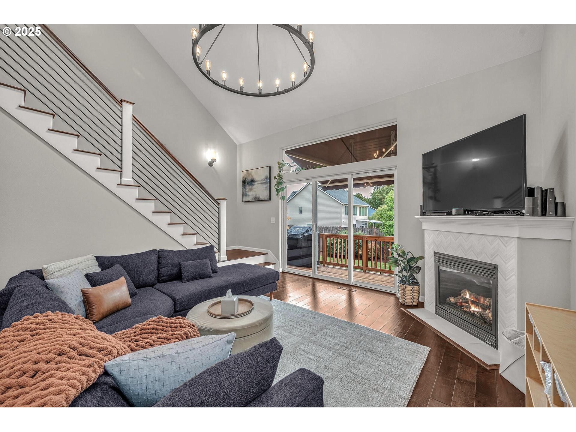 35120 Burt Road St. Helens, OR 97051 - Photo 4 of 27 a living room with furniture a fireplace and a flat screen tv